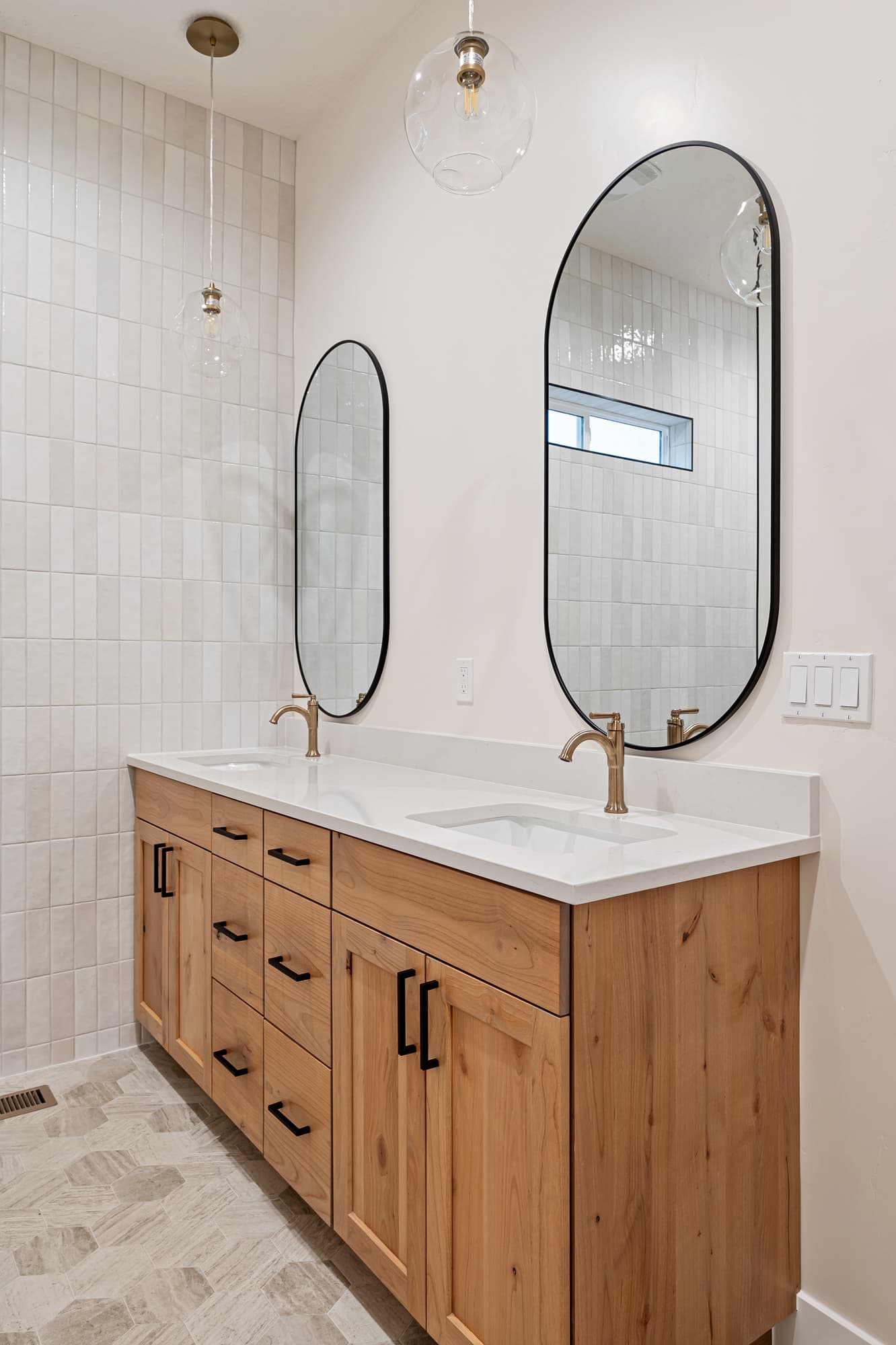 Primary bath double vanity with brass fixtures