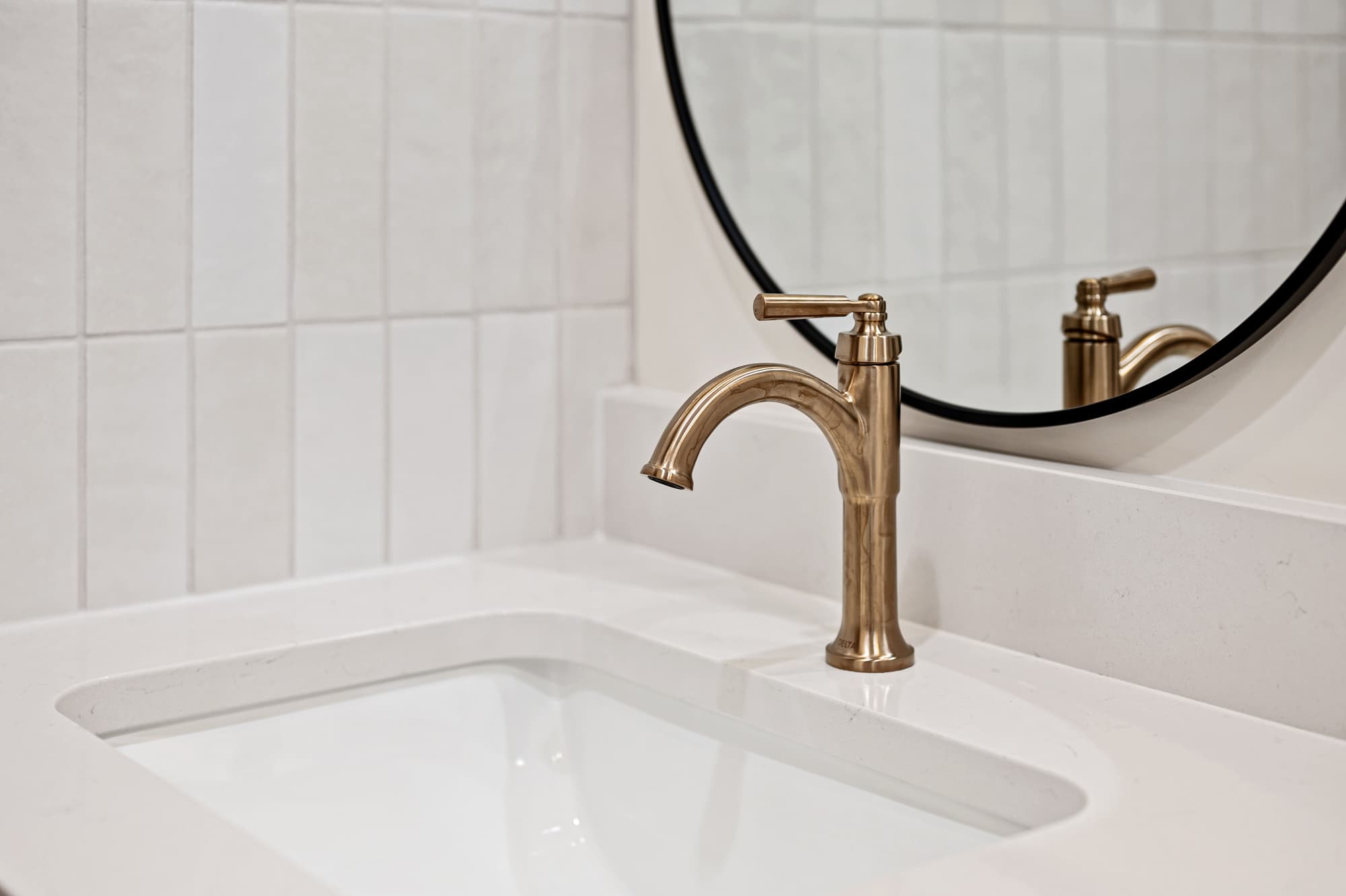 Vanity detail with brass faucet