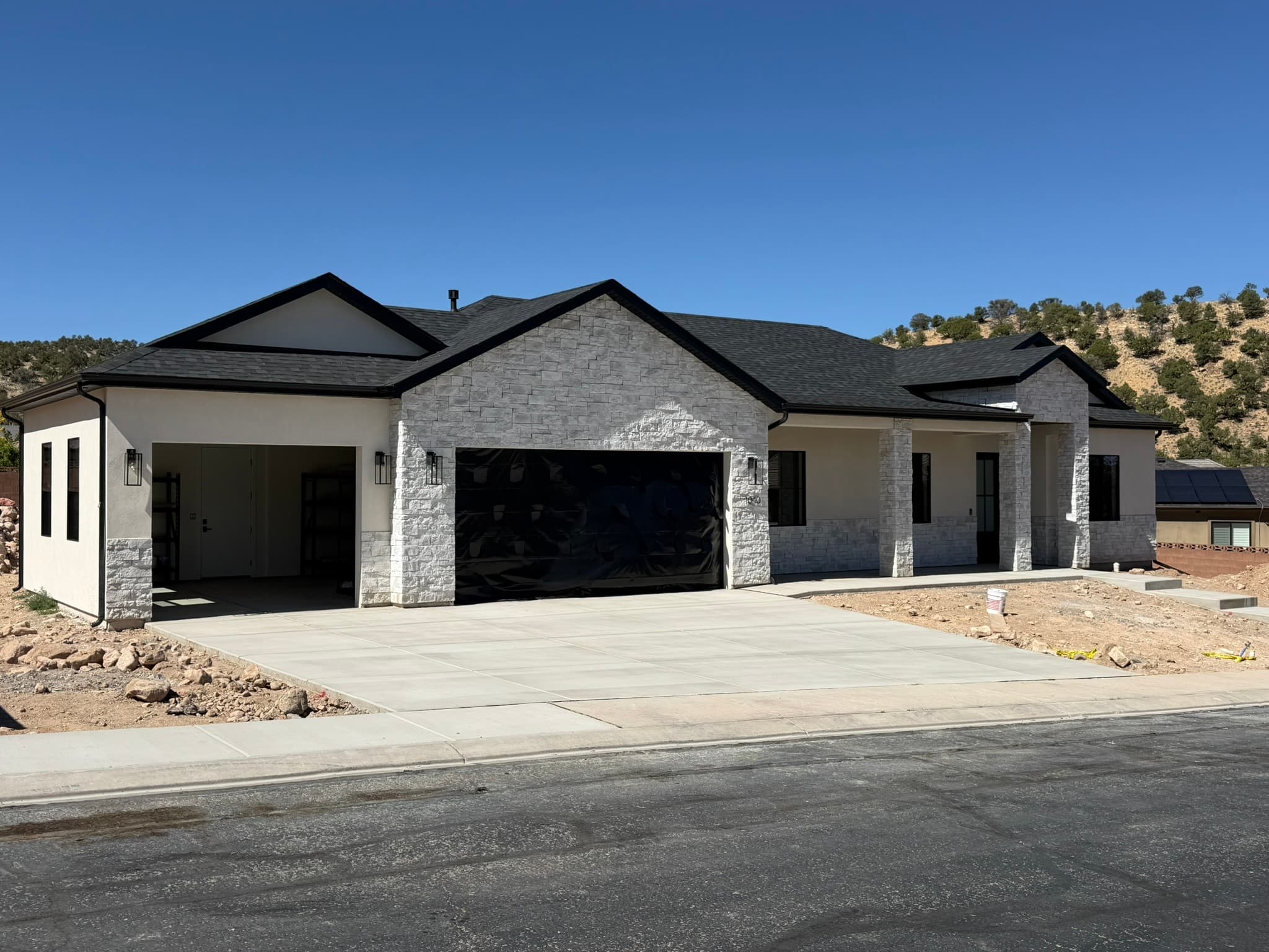 Finished single-level custom home with mountain backdrop
