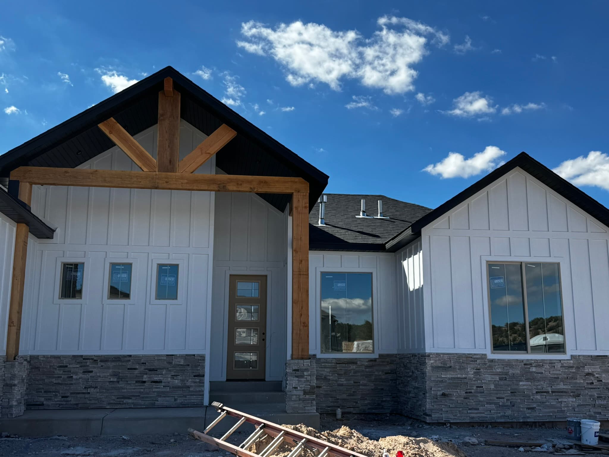 Board-and-batten gables with timber accents