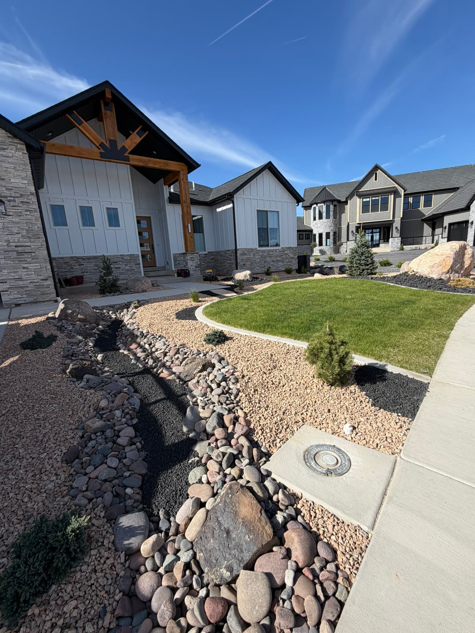 Finished modern farmhouse with landscaped yard