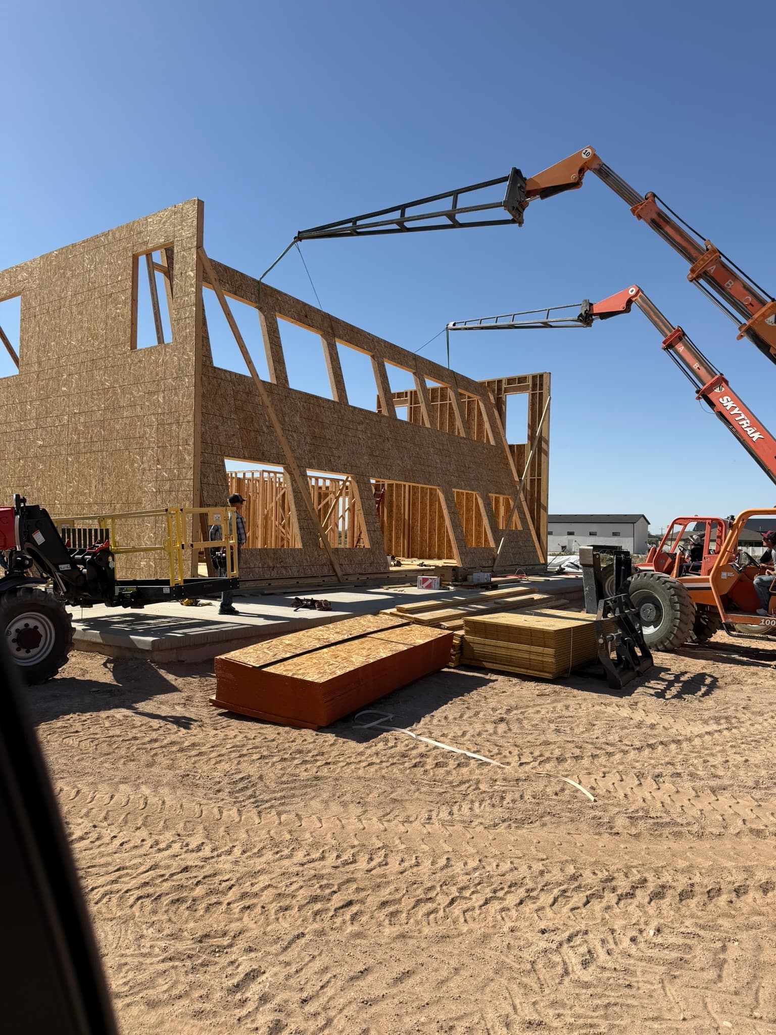 Crane setting roof trusses