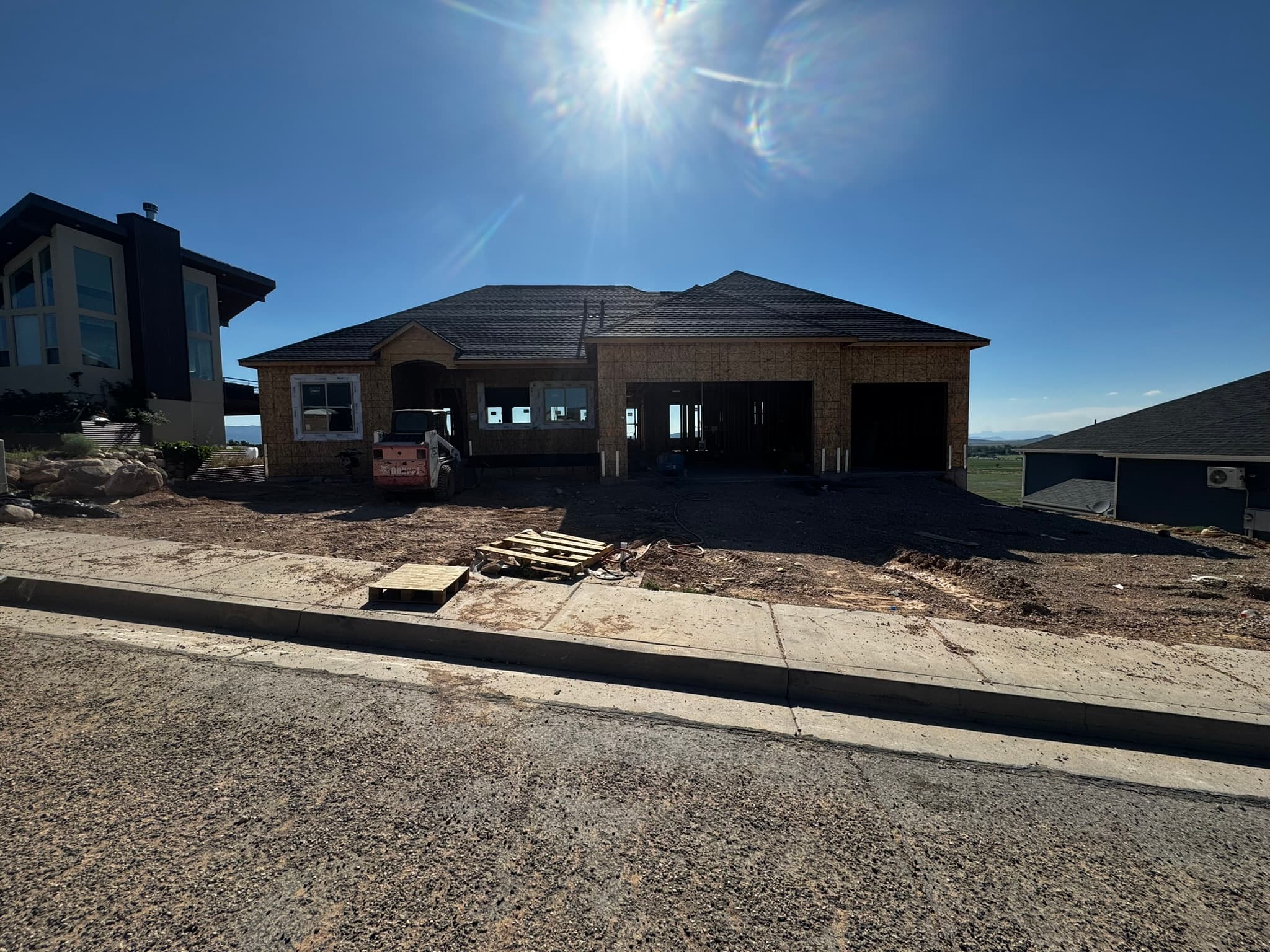 Home under construction against blue sky